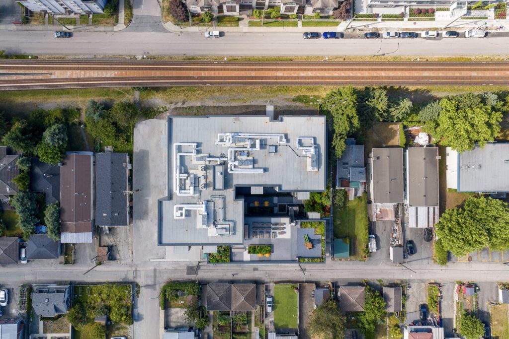 Aerial view of rooftop of multi-family building in East Vanccouver