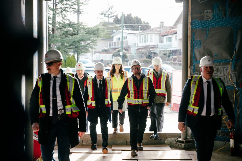 Prime Minister of Canada Mark Carney and builders walking in residential building in Vancouver, BC