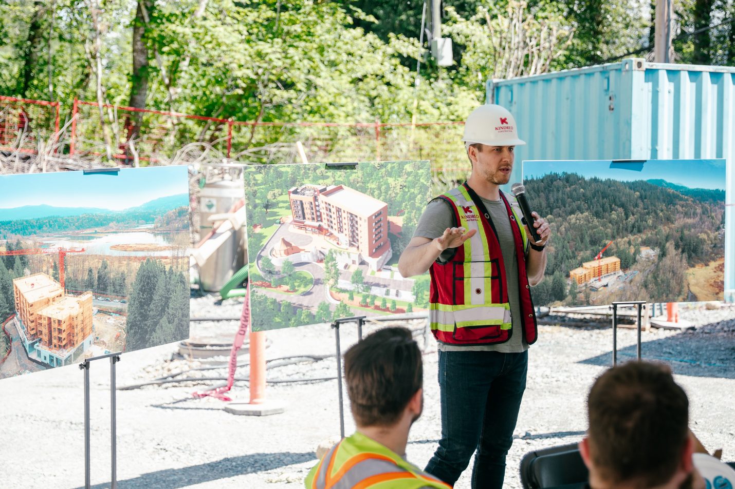 a construction manager speaking in front of a crowd